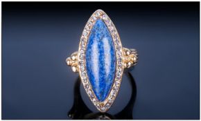 Lapis Lazuli and White Crystal Ring, a marquise cut cabochon of the classic, rich blue lapis with