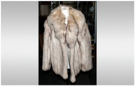 Ladies Blue Fox Fur Jacket, Fully lined. Collar with revers. slit pockets, approximate size 12.
