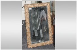 A Moulded Acorn Decorated Framed Mirror with gold highlights and bevelled glass. 16x26``