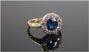 18ct Gold Sapphire And Diamond Cluster Ring Central Sapphire Surrounded By 14 Cushion Cut Diamonds,