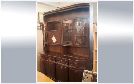 A Contemporary Mahogany Finish D Ended Side Cabinet with glazed top. With a four cupboard base