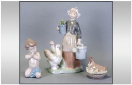 Lladro Figure Girl With Watering Can & Hens, 10`` in height together with Lladro figure of a boy