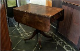 Late Georgian Breakfast Mahogany Table with one side dummy drawer. On supported turned column base,