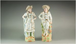 Pair of German Bisque Figures, both dressed in pastiche sailor suits, in 18thC style, the girl