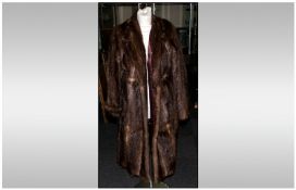 Ladies Three Quarter Length Musquash Coat, fully lined. Collar with revers. Slit pockets.