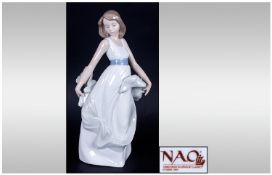 Nao By Lladro Figure, `Walking On Air` model number 1343. Mint condition. Stands 10.5`` in height,