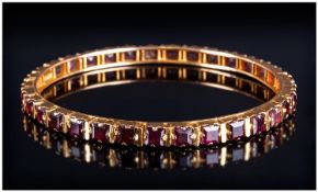 Excellent Quality High Ct Gold Garnet Set Bangle, Set with 36 Garnets of Good Colour. Marked 18/22.