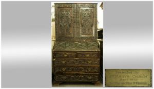 A Late Georgian Heavily Carved Bureau Bookcase, the bookcase with carved floral decorative panels,