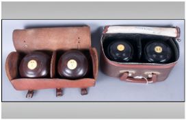 Two Sets of Crown Bowls, in original cases.