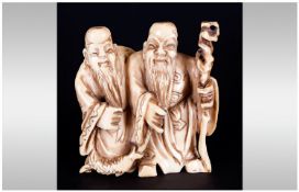 Japanese Signed Late 19th Century Carved Ivory Netsuke in the form of two wise men with staff, 1.