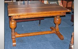 Oak Refectory Type Dining Table with a pop up leaf which makes the top wider. Supported by two