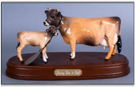 Beswick Farm Animal Figure `Jersey Cow & Calf` on a wooden plinth. Model number 1345. Issued 1993-