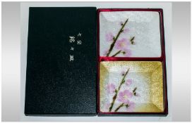 A Pair Of Japanese Enamel Trays, decorated with pink cherry blossom. In original card box