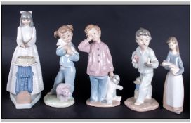 Five Nao By Lladro Figures, comprising boy with teddy, girl cutting cake, girl with lamb, girl