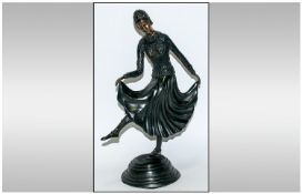 Twentieth Century Bronze Figure in the form of a 1930`s dancer, raised on a stepped circular base;