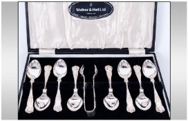 Walker and Hall Boxed Set of 8 Silver Teaspoons and Matching Sugar Nips In The Kings Pattern.