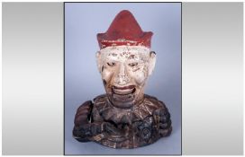 Antique Mechanical Cast Iron Handpainted Money Bank in the form of an early clown. Unrestored. 7.