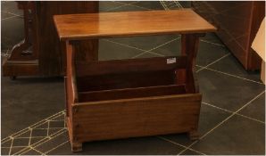 Magazine Table with rack below on four square feet. 24x11'' top 20'' in height.