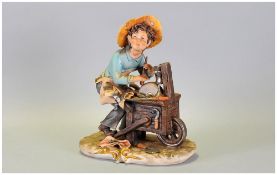Capo-Di-Monte Signed Figure ' Young Knife Sharpener ' Signed Corti. Stands 8.25 Inches High.