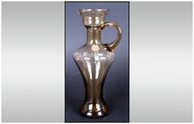 Emboli - Shaped Glass Jug, Labelled. Stands 7.25 Inches High, Excellent Condition.