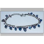 Tanzanite and Amethyst Charm Bracelet, polished ovoid tanzanites and small faceted amethysts