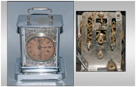 A Late 19th Century Silvered Metal Carriage Clock with a paper dial with two winding points to the