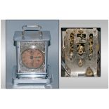A Late 19th Century Silvered Metal Carriage Clock with a paper dial with two winding points to the