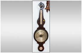 Late Georgian Mahogany Mercurial Barometer with a silver engraved dial, with an unusual round top