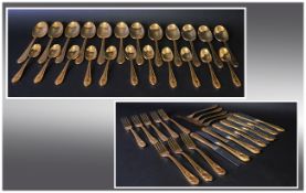 Gilt Metal Flatware Comprising 12 Dinner Forks, Knives & Spoons And 11 Teaspoons