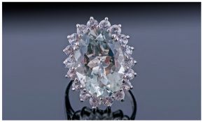 Green Amethyst and White Topaz Cocktail Ring, a large oval cut green amethyst of 11.5cts, set in a