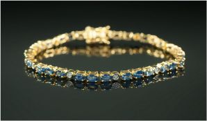 Blue Sapphire and White Sapphire Tennis Bracelet, rows of three oval cut blue sapphires