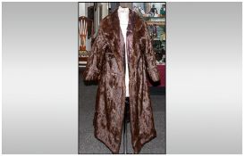 Ladies Three Quarter Length Squirrel Dark Brown Coat. Fully lined. Collar with revers. Hook & Loop