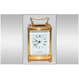 English Good Quality 8 Day Brass Carriage Clock with visible escapement. White porcelain dial. Key