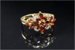 9ct Gold Diamond Dress Ring, Set With A Central Cluster Of Garnets Between Diamond Spacers, Fully