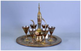 Indian Brass Decanter Set with goblets & inlaid circular tray.