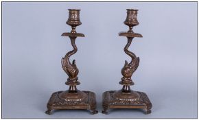 Pair Antique Florentine Cast Bronze Candlesticks in the form of a Dolphin Holding up the Sconces, On