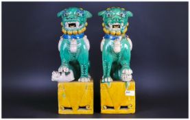 Sanchai Ware Temple Foo Dogs In The Traditional Coloured Glazes, The Pair Seated on a Square Pierced