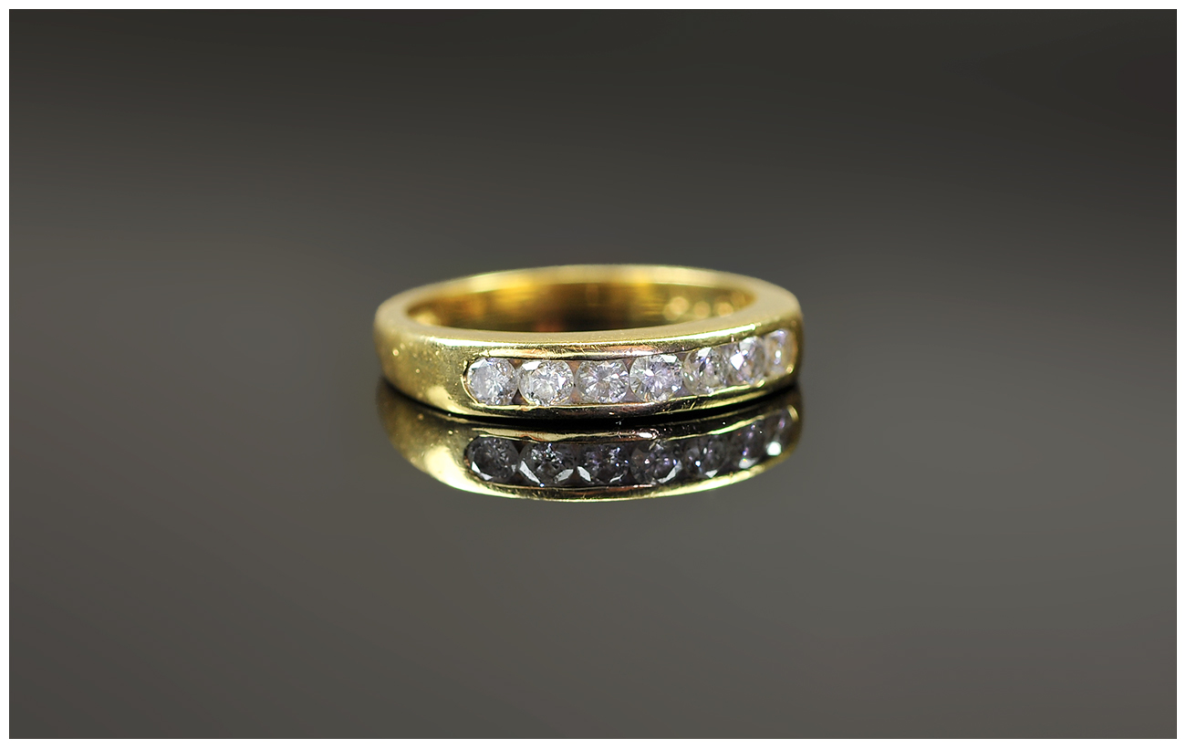 18ct Yellow Gold Channel Set Diamond Ring The diamond of good colour. Est Weight 50pts.  Fully