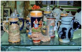 Collection of German Steinware Tankards (9) in total. Together with a German Boot Ornament and