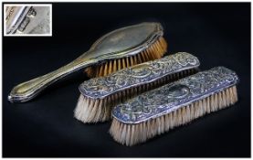 Three Silver Backed Brushes. AF