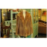 Ladies Light Brown Musquash Jacket, fully lined. Cuff sleeves, Collar with revers. Slit pockets,