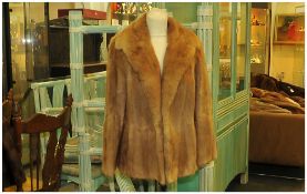 Ladies Light Brown Musquash Jacket, fully lined. Cuff sleeves, Collar with revers. Slit pockets,