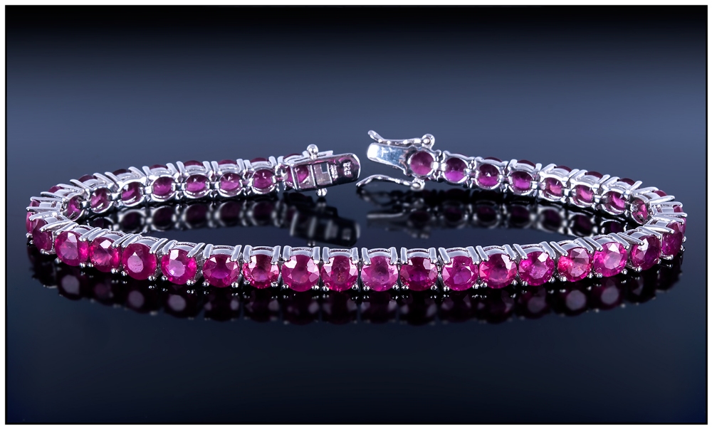 Ruby Tennis Bracelet, 25cts of round cut, rich red rubies set in a continuous line and fastened with - Image 2 of 5