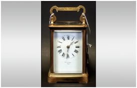 French Antique 8 Day Striking Carriage Clock striking on a gong with visible escapement. Retailed by