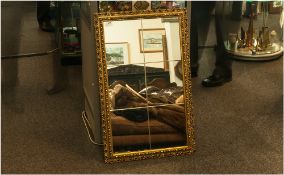 Contemporary Gilt Framed Mirror with 6 bevelled glass panels. 19 by 30 inches.