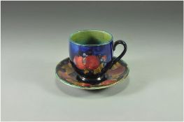 William Moorcroft Small Cup and Saucer ' Pomegranate ' Design on Blue Ground. c.1920's. Size -