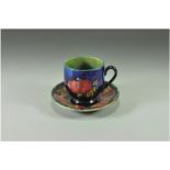 William Moorcroft Small Cup and Saucer ' Pomegranate ' Design on Blue Ground. c.1920's. Size -