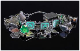 A Good Quality Vintage Silver Charm Bracelet, Loaded with Some Interesting Charms. Marked Silver