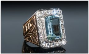 A Fine and Impressive 18ct Gold Set, Aquamarine and Diamond Ring. The Central Single Faceted