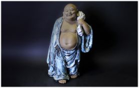 Large Chinese Stoneware Buddha Standing Carrying a Sack, Wearing a Glazed Blue Toga. Height 19